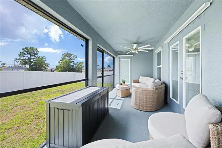 Sunroom / solarium with ceiling fan and outdoor seating
