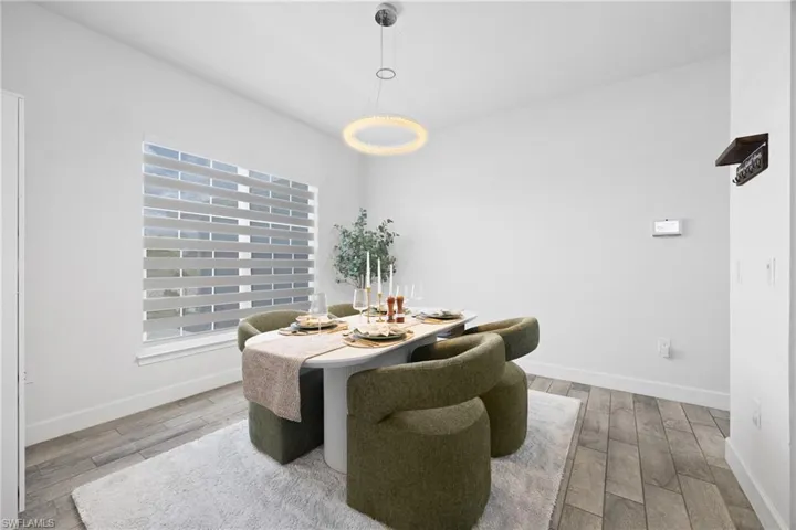Dining room featuring baseboards and light wood-style floors