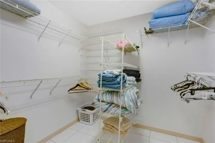 Double-size walk-in closet in primary suite.
