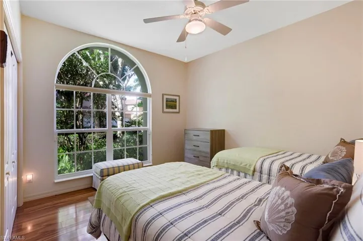 Guest bedroom is large and bright.