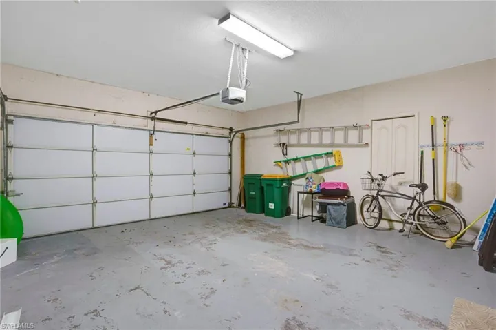 Spacious two-car garage is directly off the laundry room, with easy access to kitchen.