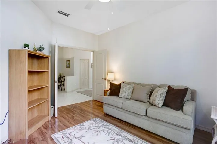 Den is bright and roomy. Double doors allow for privacy for working or sleeping.