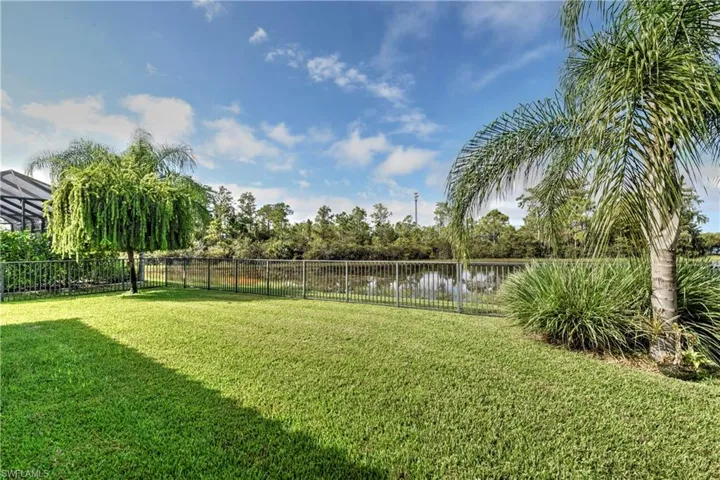 View of yard with a water view