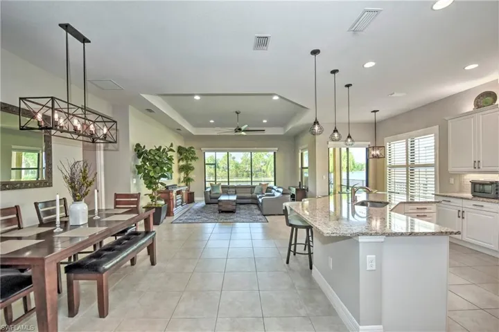 Open Concept Living Area featuring kitchen overlooking dining room, living room & beautiful water view