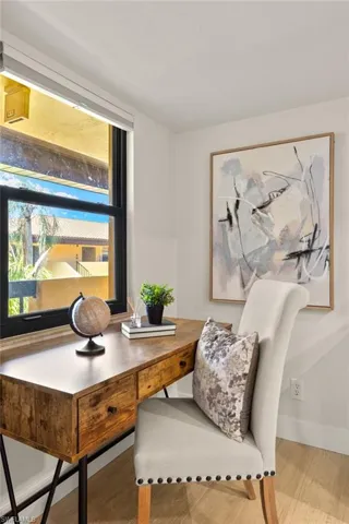 Office space featuring wood finished floors and baseboards