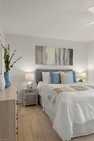 Bedroom with light wood-style floors and baseboards