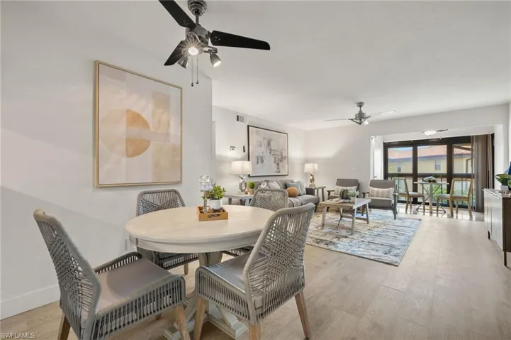 Dining area featuring a ceiling fan and wood finished floors