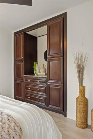 Bedroom featuring light wood finished floors and baseboards