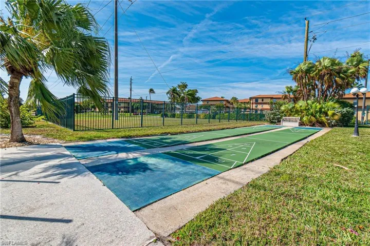 View of home's community featuring shuffleboard