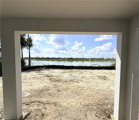 Underneath covered lanai. Home under construction. Beautiful backyard water view with western exposure on Lake Babcock
