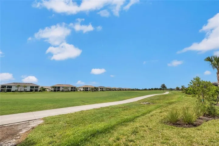 Enjoy the views of the golf course off your back yard oasis living the Florida dream