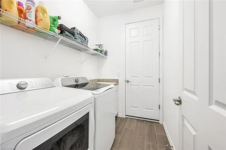 Laundry Room with sink washer & dryer convey with property