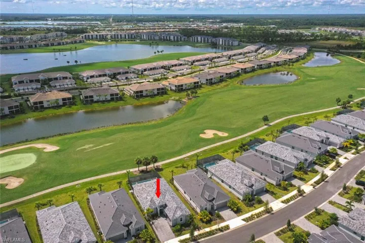 Bird's eye view with a water view & golf course