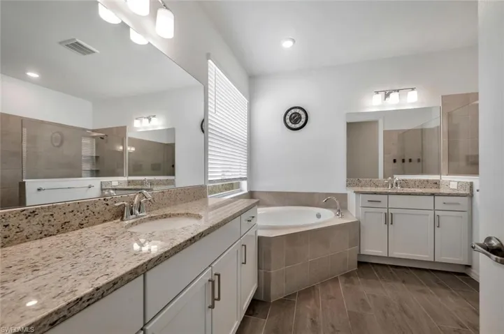 Primary Bathroom with double vanities, separate shower and tub very spacious