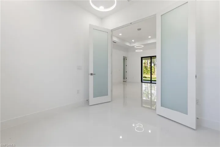 Spare room featuring recessed lighting and baseboards