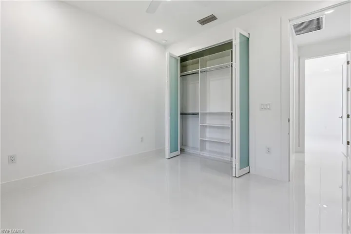 Unfurnished bedroom with a ceiling fan, a closet, and recessed lighting