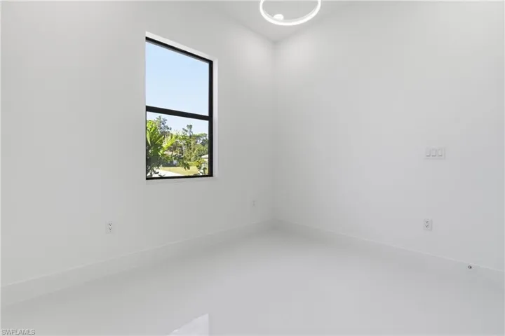 Unfurnished room featuring baseboards