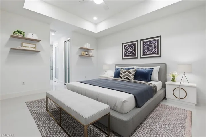Bedroom featuring a raised ceiling, ceiling fan, recessed lighting, and concrete floors