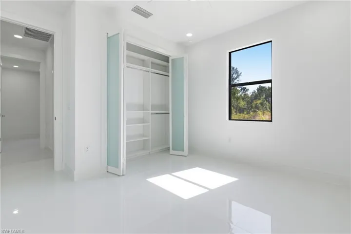 Unfurnished bedroom featuring a closet and recessed lighting