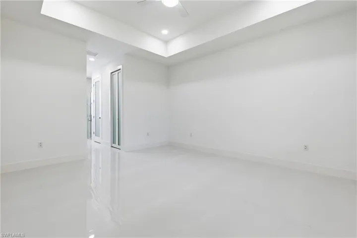 Spare room with ceiling fan and recessed lighting