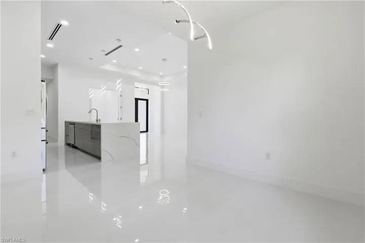 Unfurnished living room featuring recessed lighting