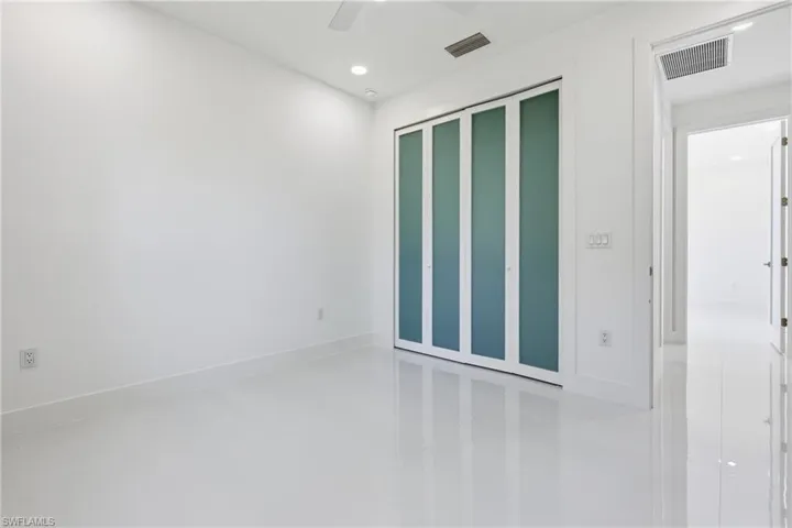 Spare room featuring recessed lighting and a ceiling fan