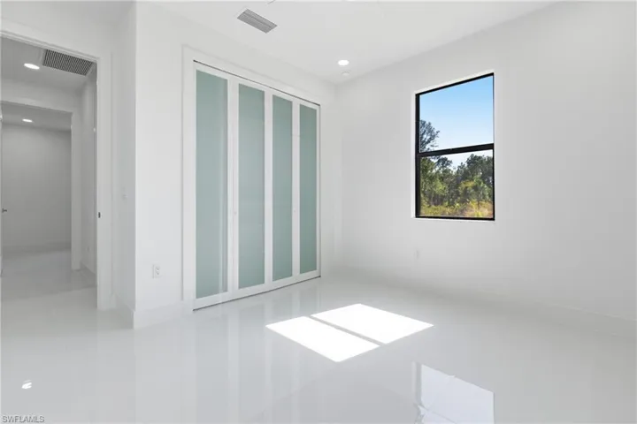 Unfurnished bedroom featuring a closet and recessed lighting