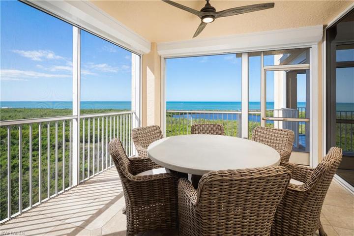 Screened Lanai off Kitchen with Sweeping Southwestern Gulf of Mexico, Inner Clam Bay, and Park Shore Skyline views.