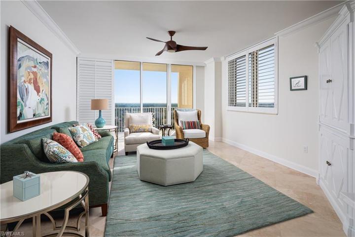 View of Family room. Family Room has it's own Balcony with Sweeping Pelican Bay views and Gulf of Mexico Views.