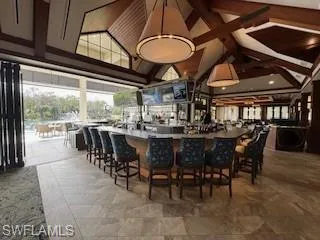 Bar area with a high ceiling