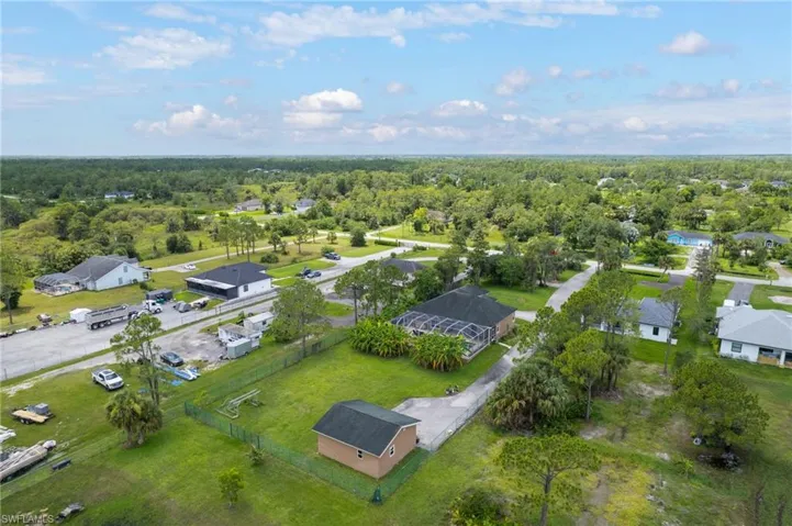 Aerial overview of property's location featuring a heavily wooded area