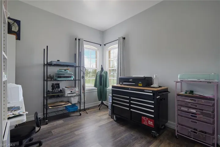 Office featuring wood finished floors and baseboards