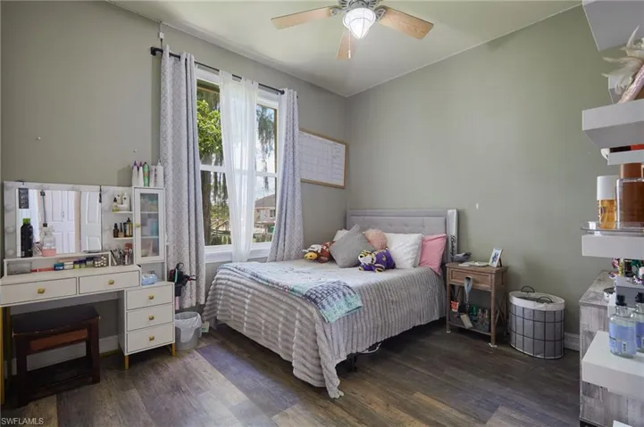 Bedroom featuring wood finished floors and ceiling fan