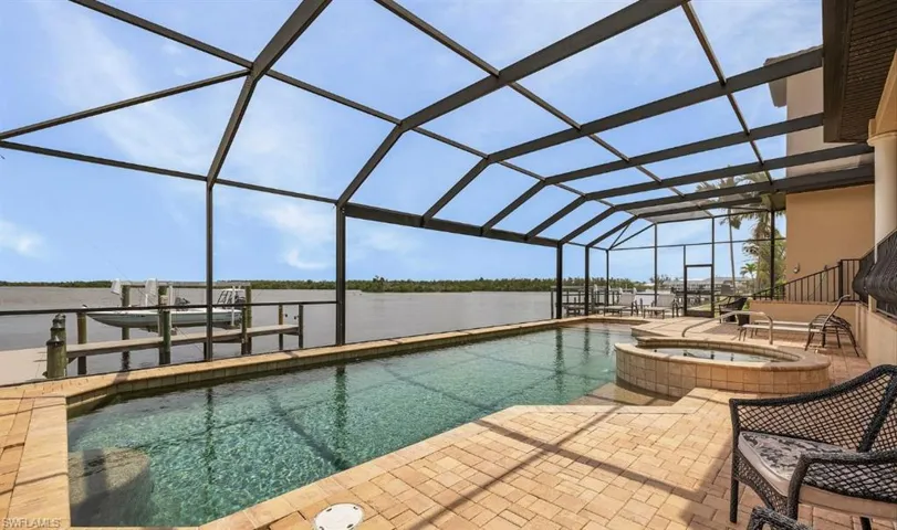 Lanai featuring a large pool, spa with amazing views