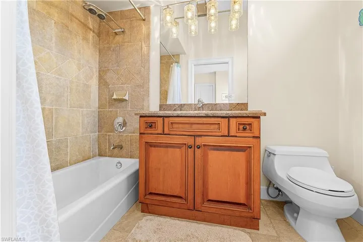 Bathroom featuring a tiled shower and bathtub combination