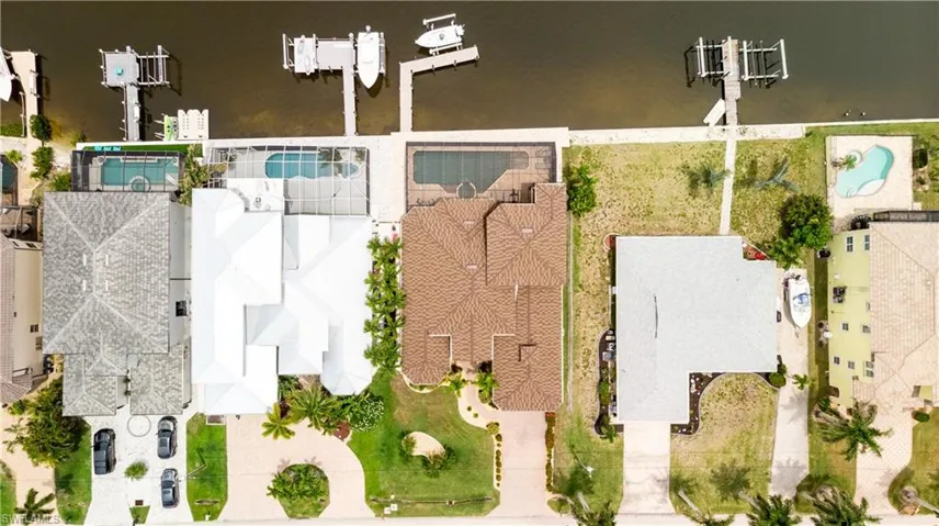 Waterfront property featuring a private boat dock and direct canal access
