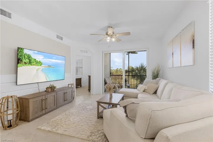 Tiled living room with ceiling fan