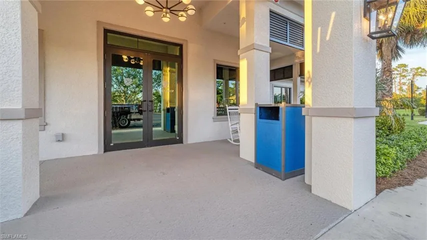 Entrance to property featuring ceiling fan and french doors