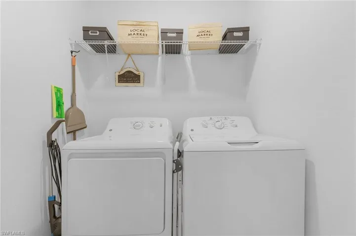 Washroom featuring separate washer and dryer