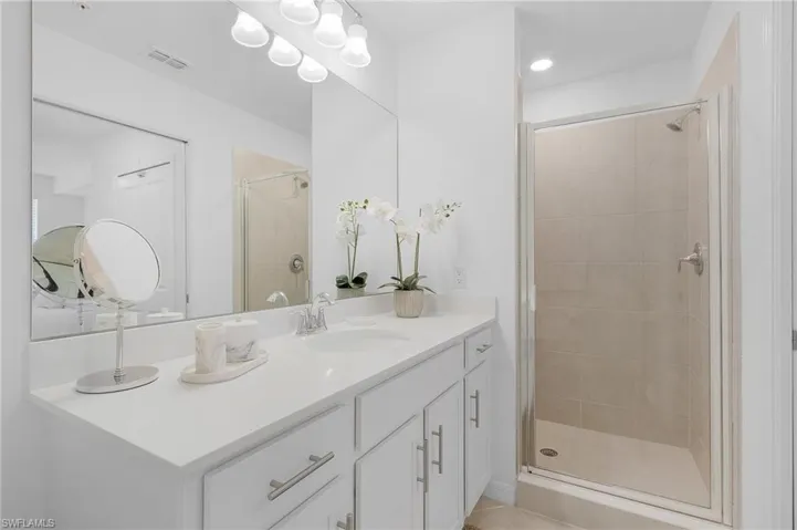 Bathroom with vanity and walk in shower
