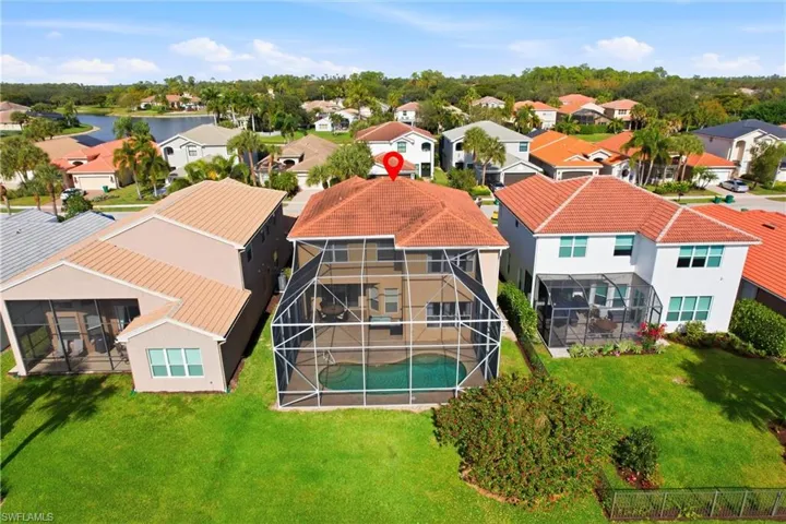 Aerial perspective of suburban area with a pool