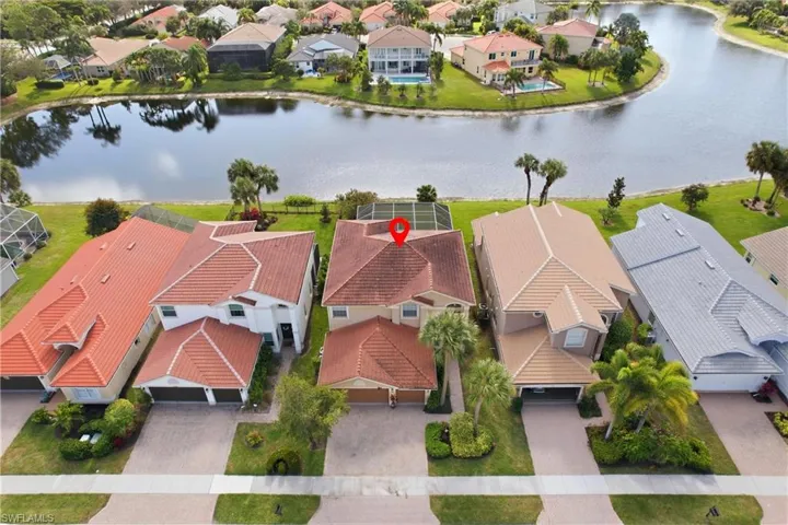 Aerial perspective of suburban area with a nearby body of water