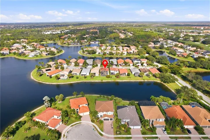 Aerial overview of property's location with nearby suburban area and a large body of water