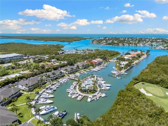 Aerial perspective showcasing a waterfront community with direct bay access