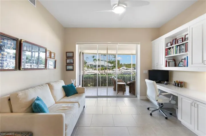 Spacious interior featuring neutral wall tones and tile flooring