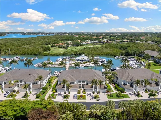 Waterfront community featuring multi-story residences with attached garages