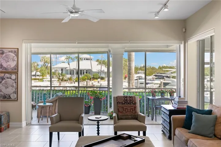 Expansive screened balcony featuring waterfront views and a white column