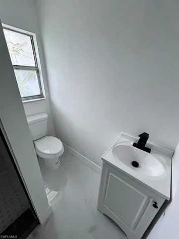Bathroom with vanity and toilet