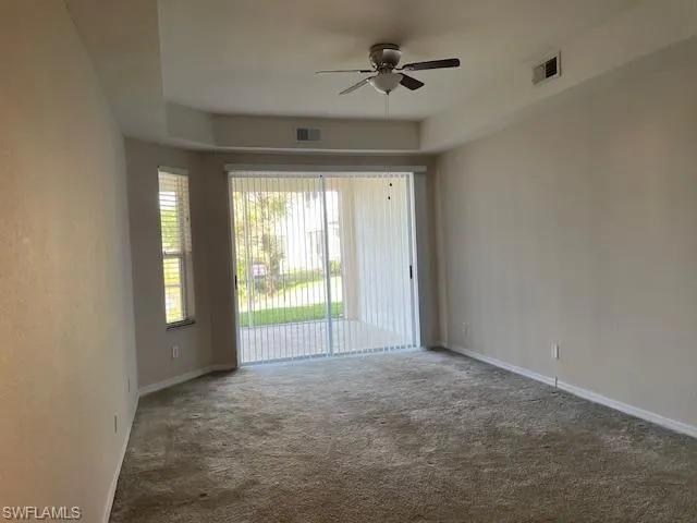 Large Master Suite with sliding doors to lanai for lake view.