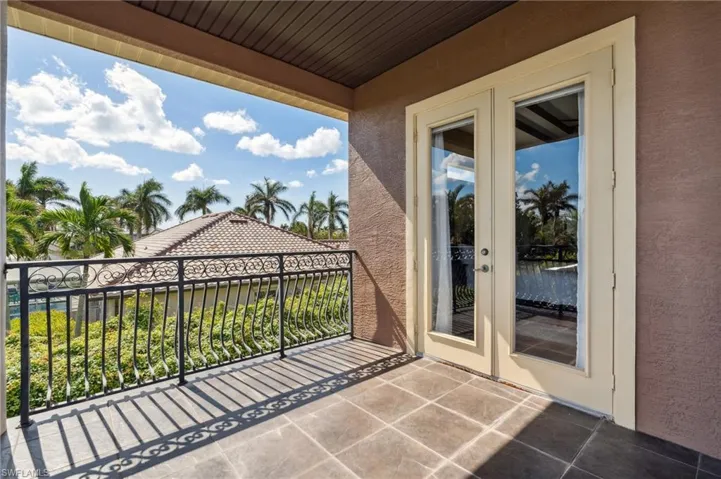 Balcony featuring french doors